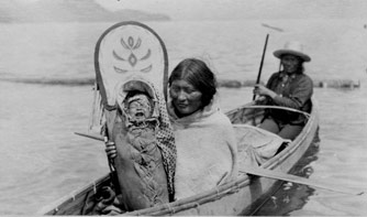 Family in a sturgeon-nosed canoe